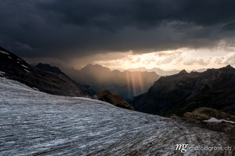 spectacular light rays in the Bernese Alps after a thunderstorm. Taken by Marcel Gross Photography