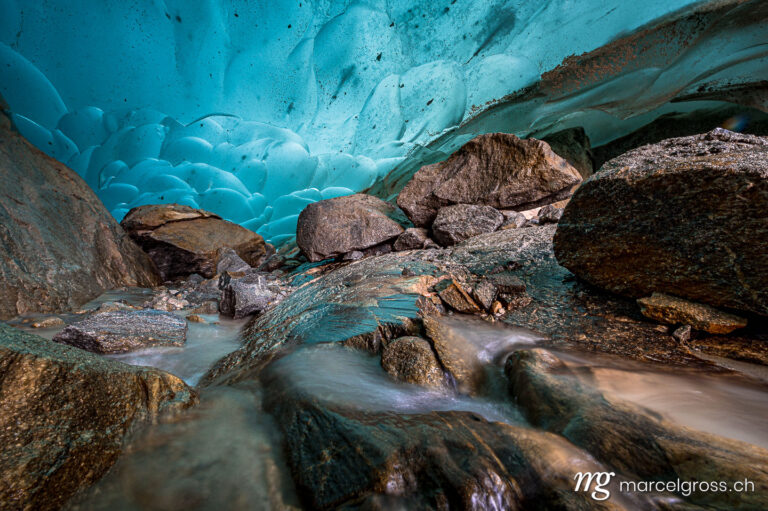 below the Aletsch Glacier in an ice cave. Taken by Marcel Gross Photography