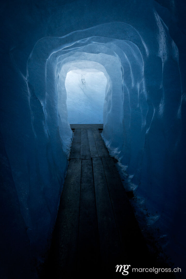 . path through ice cave in Glacier in switzerland. Marcel Gross Photography