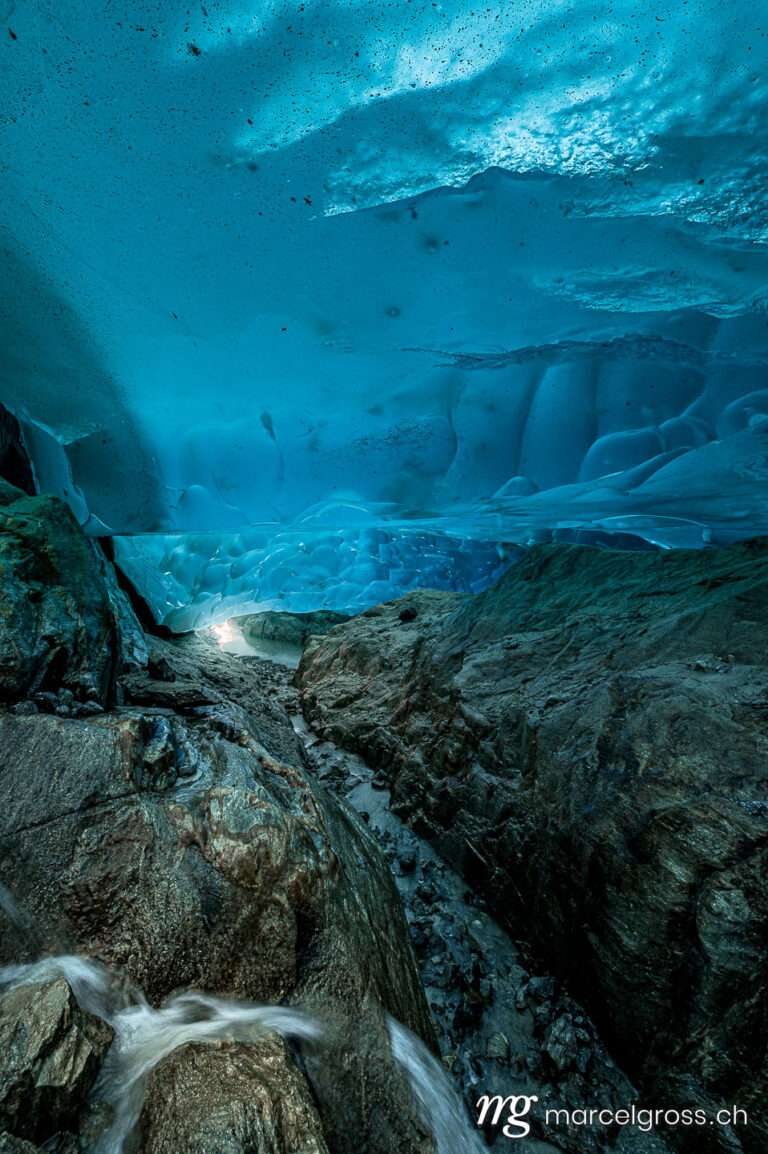 . below the Aletsch Glacier in an ice cave. Marcel Gross Photography
