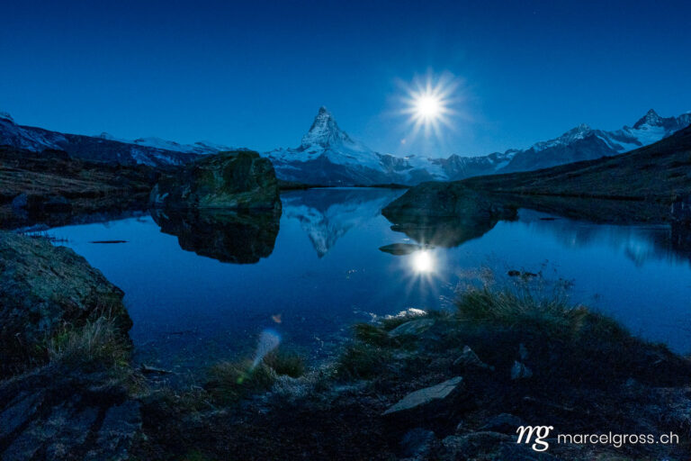 . Matterhorn at full moon with reflection in alpine lake. Marcel Gross Photography