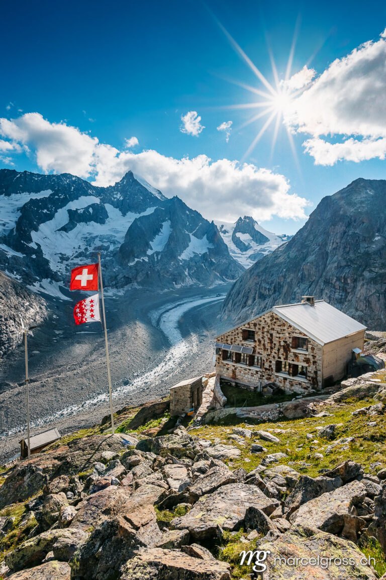 . Oberaletsch Mountain hut with Oberaletsch Glacier and the Swiss and Valais Flag. Marcel Gross Photography