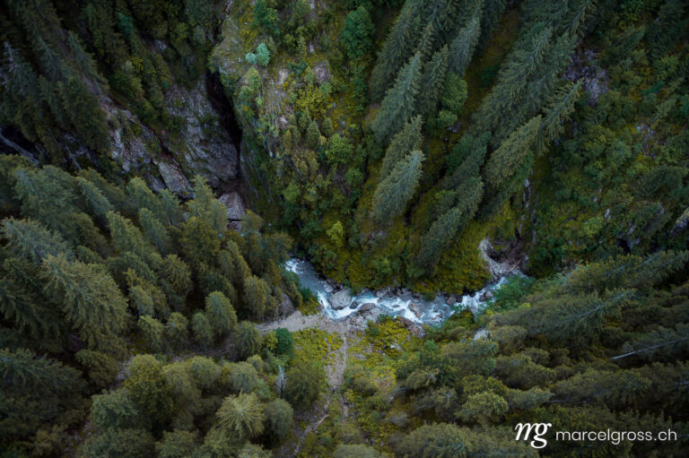 . aerial view into a wild gorge in the swiss alps. Marcel Gross Photography