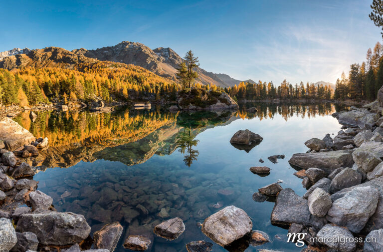 Panorama pictures Switzerland. Golden autumn at Lago di Saoseo in Val di Campo, Poschiavo, Switzerland. Marcel Gross Photography