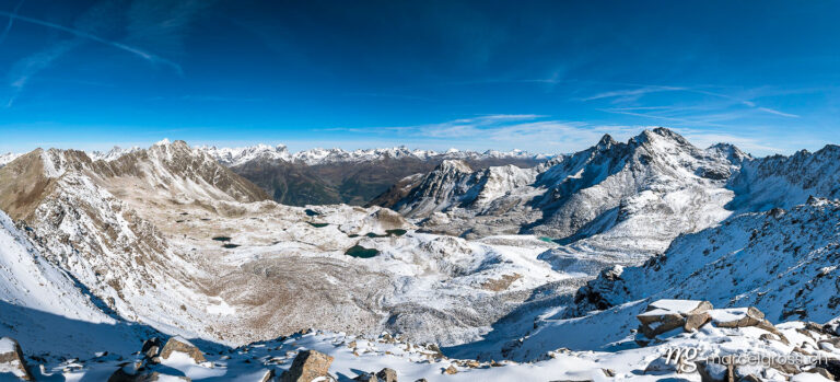 . panoramic view over Macun Lakes in autumn with the first snow. Marcel Gross Photography
