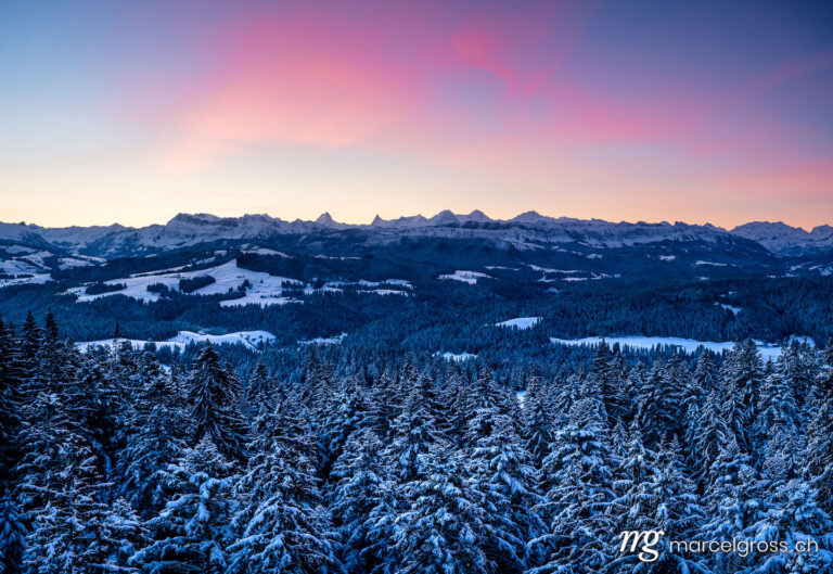 dawn in Emmental with Bernese Alps like Schreckhorn, Finsteraarhorn and Eiger, Mönch and Jungfrau in the distance. Taken by Marcel Gross Photography