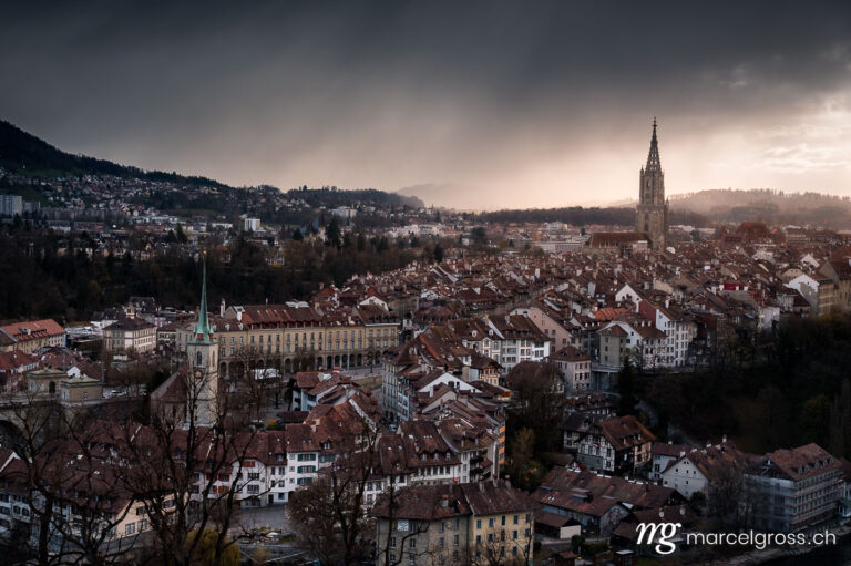 Bern pictures. dramatic clouds over the old town of Bern in spring. Marcel Gross Photography