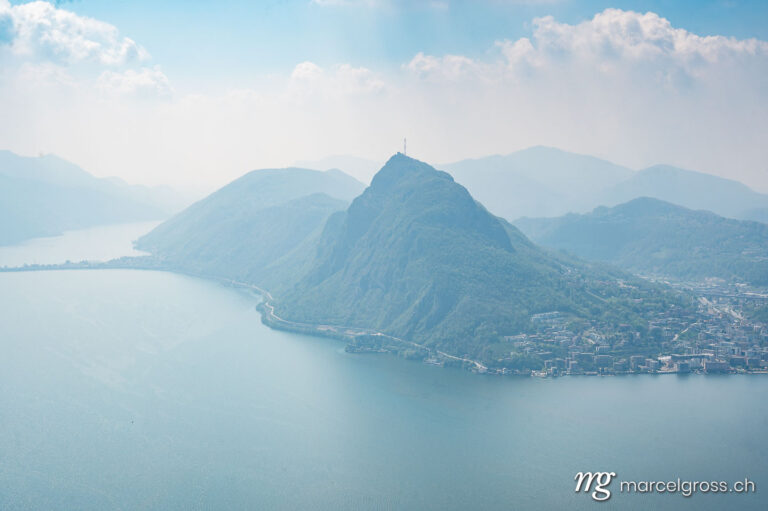 Tessin Bilder. hazy view from monte bre near lugano with Lago di Lugano. Marcel Gross Photography