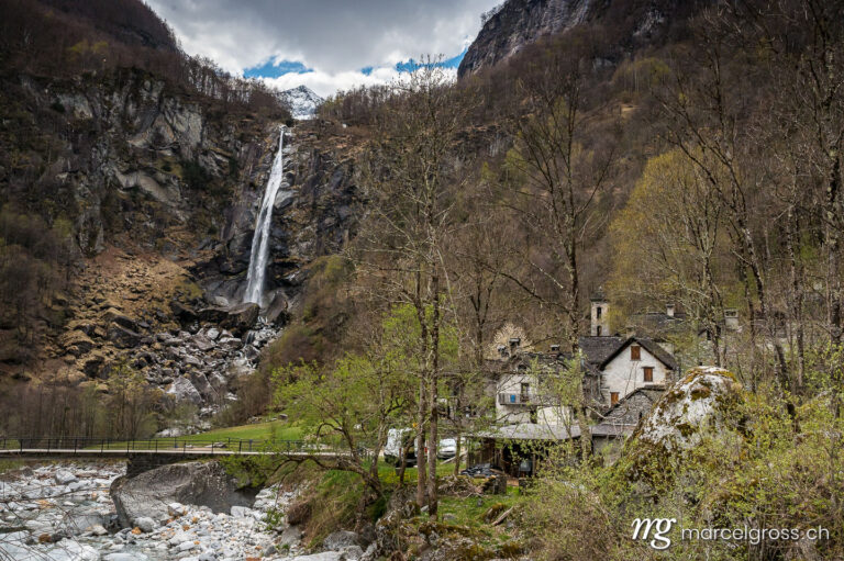 Tessin Bilder. picturesque town of Foroglio with the impressive waterfall in spring, Valle di Bavona, Ticino. Marcel Gross Photography