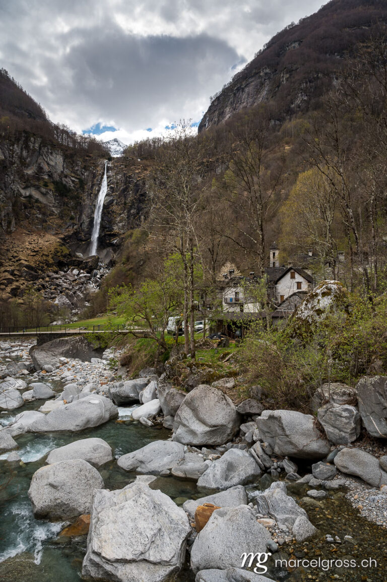 Tessin Bilder. picturesque town of Foroglio with the impressive waterfall in spring, Valle di Bavona, Ticino. Marcel Gross Photography