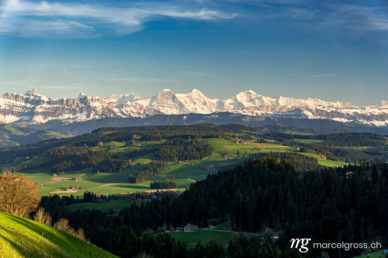 Panorama pictures Switzerland. view from Mooseegg over the hills of Emmental towards the mighty Bernese Alps. Marcel Gross Photography