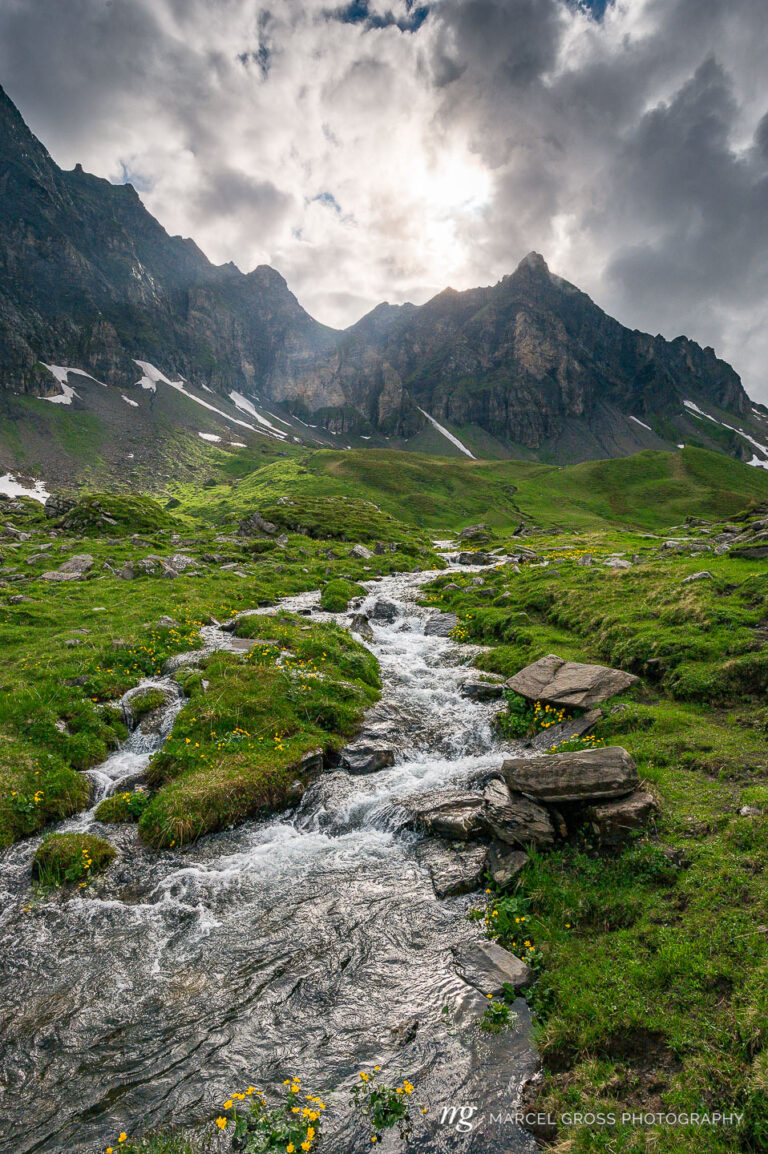 alpine creek with peak of Hochstollen near Melchseefrutt. Taken by Marcel Gross Photography