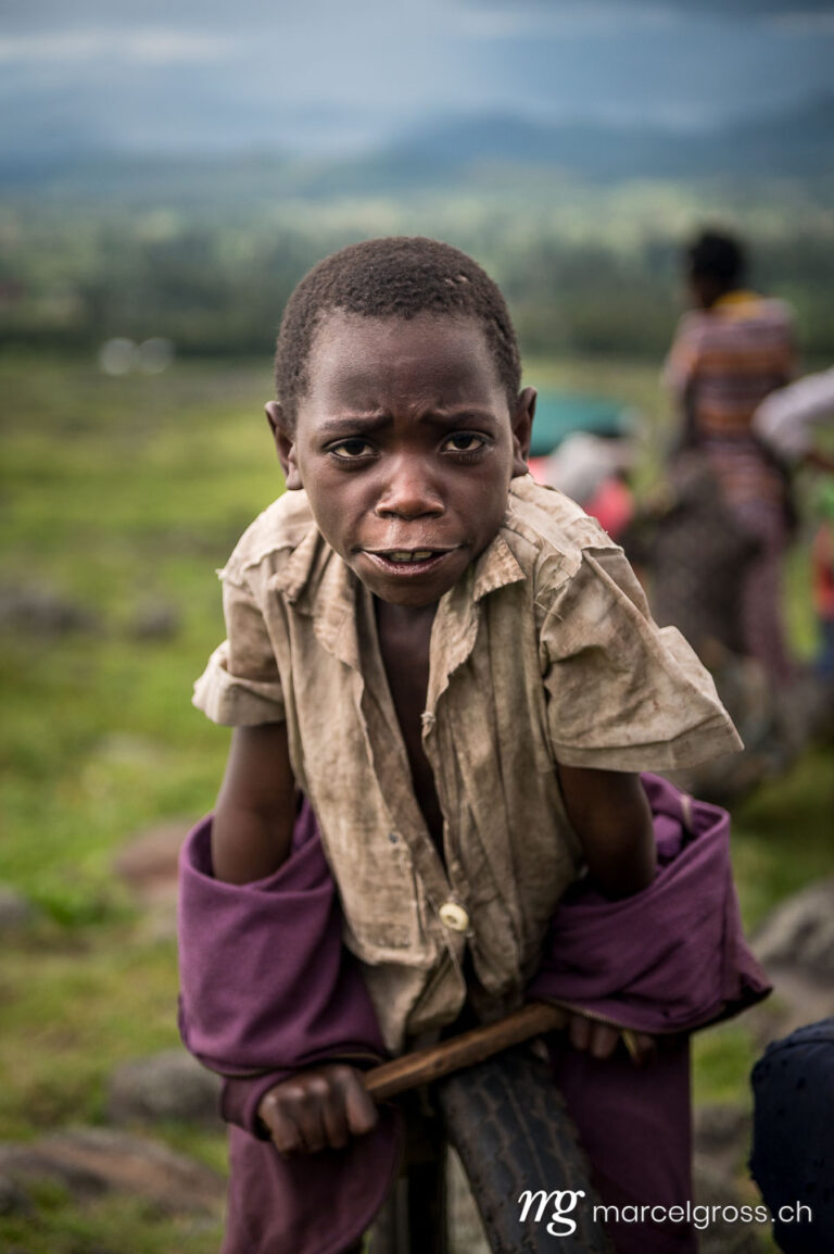 Uganda pictures. Batwa boy in a village near in Mgahinga Gorilla National Park, Uganda. Marcel Gross Photography