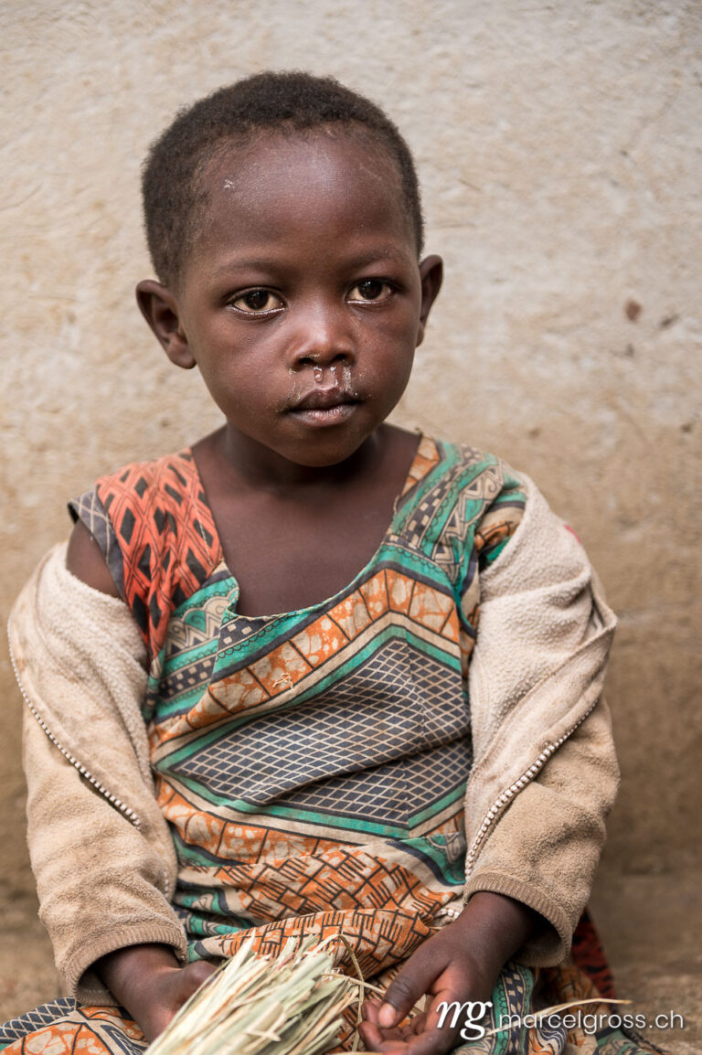 Uganda Bilder. baby in a village southern Uganda. Marcel Gross Photography