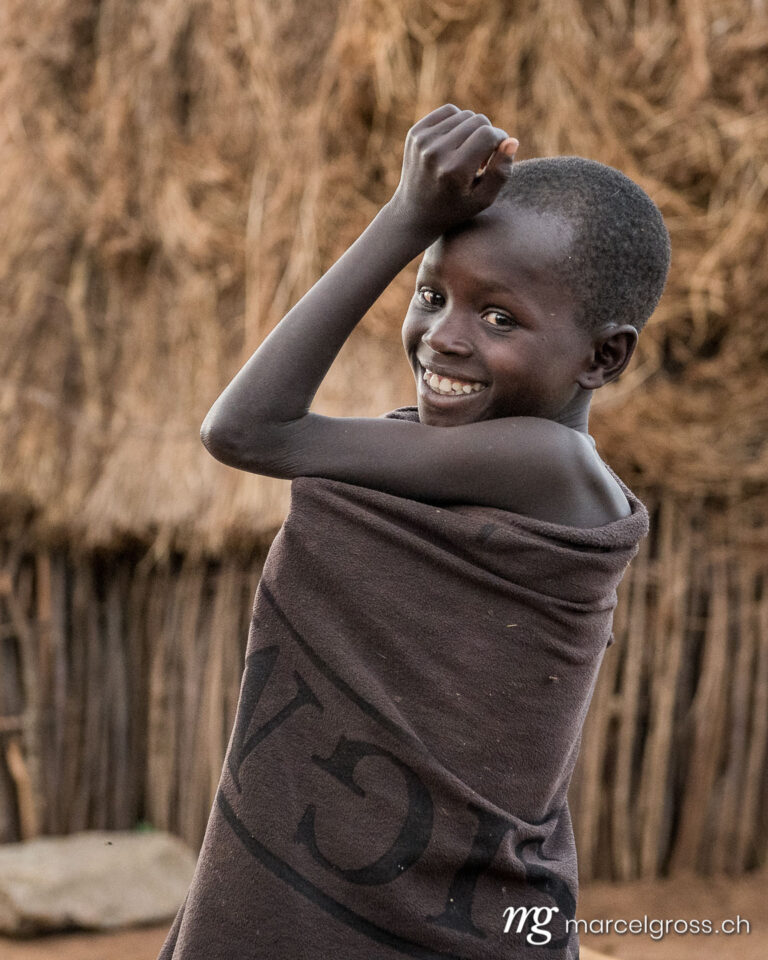Uganda Bilder. a karamojong boy in the remote Karamoja Region of Uganda. Marcel Gross Photography