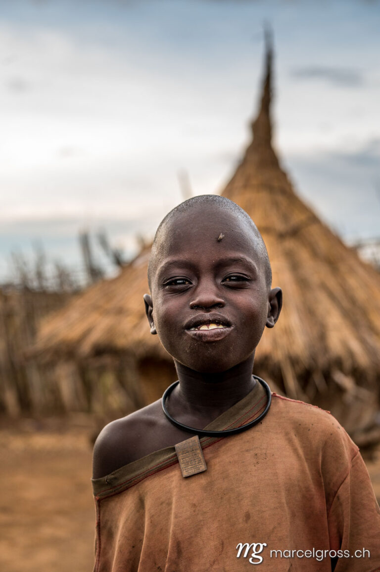 Uganda pictures. a karamojong boy in the remote Karamoja Region of Uganda. Marcel Gross Photography