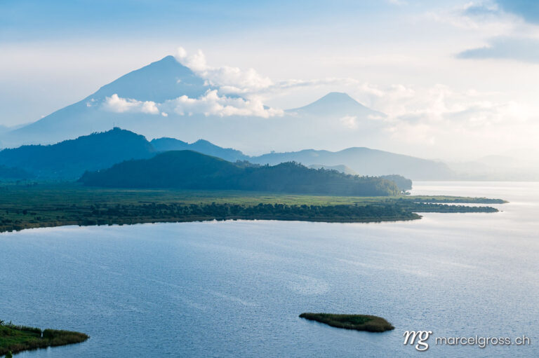 Uganda pictures. landscape of Mount Muhabura and Lake Mutanda in the late afternoon. Marcel Gross Photography