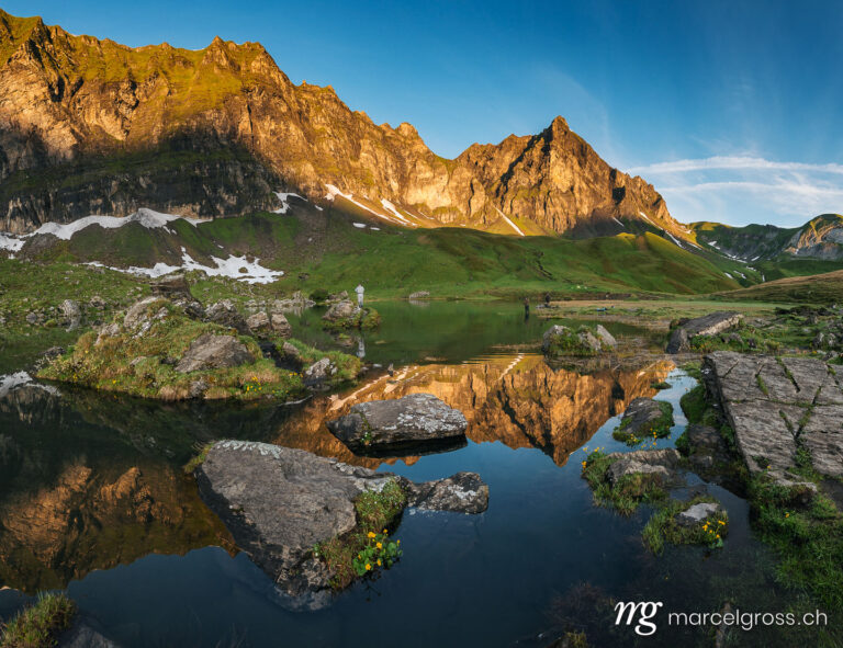 Summer pictures Switzerland. Peak of Hochstollen with reflection in alpine lake near Melchseefrutt at sunrise in the swiss alps. Marcel Gross Photography