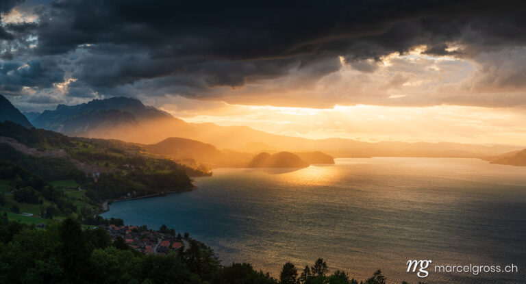 . dramatic sunset over Lake Thun with Stockhorn ridge, Spiez and Faulensee. Marcel Gross Photography