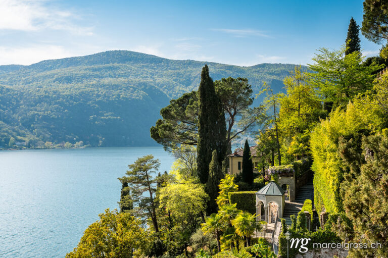 Tessin Bilder. lush garden in Morcote in spring with a view of Lake Lugano. Marcel Gross Photography