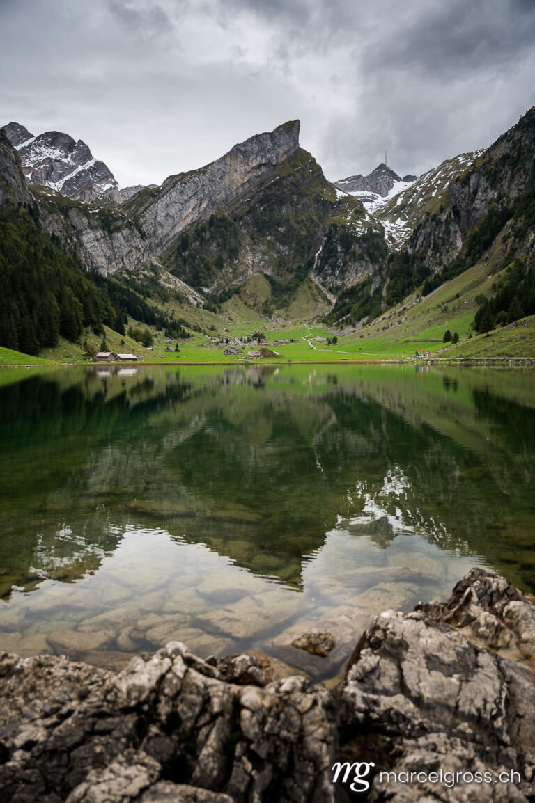 Eastern Switzerland pictures. Reflection of mountains in Seealpsee on a moody day. Marcel Gross Photography