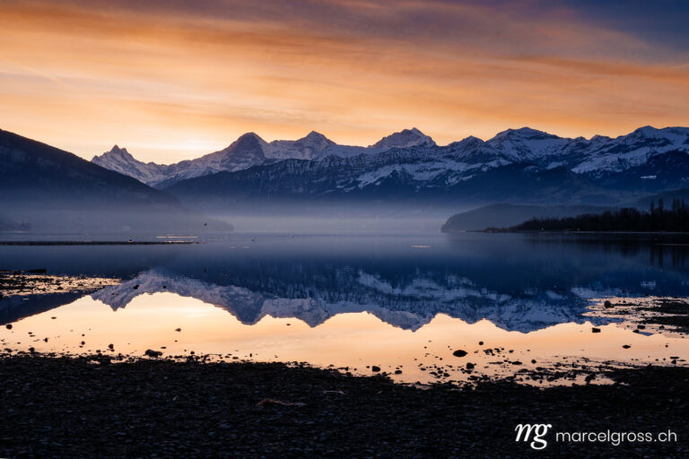 Bernese Oberland pictures. Sunrise on Lake Thun with Eiger Mönch and Jungfrau. Marcel Gross Photography